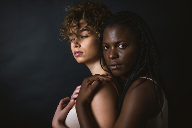 Multicultural group of beautiful women posing in underwear