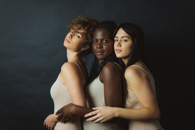 Multicultural group of beautiful women posing in underwear 