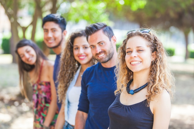 Multicultural group of friends at park