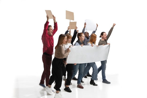 Photo multicultural group of people screaming while holding blank placards on white wall
