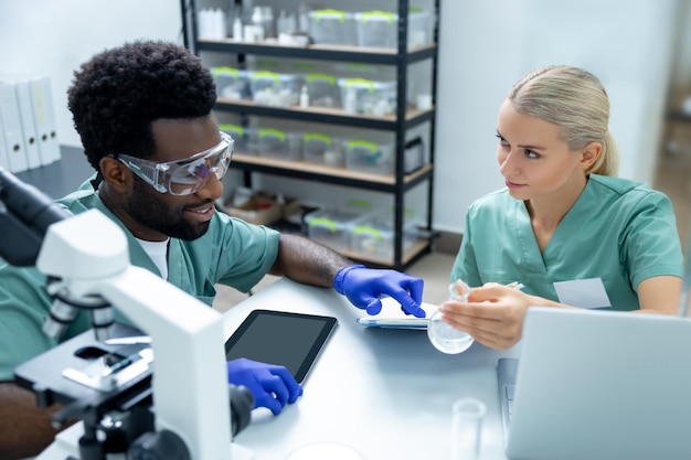 multicultural medical woman and man working together in office for research