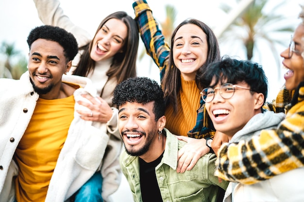 Multicultural students cheering at travel location