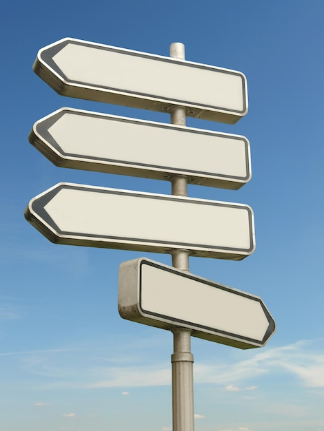 Photo multidirectional blank metal signpost over blue sky