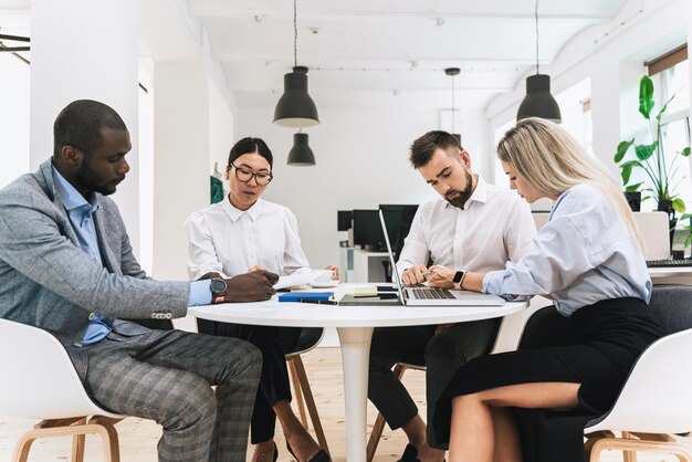 multiethnic business people during meeting in modern office