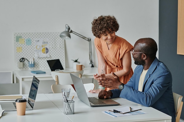 Multiethnic colleagues working in team at office