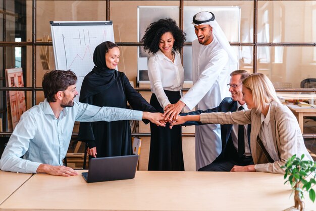 Multiethnic corporate business team meeting in the office for a strategic marketing plan - Office workers, entrepreneurs and company employee at work in a multinational company