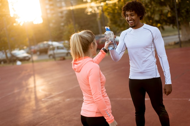 Multiethnic couple doing sport outdoors