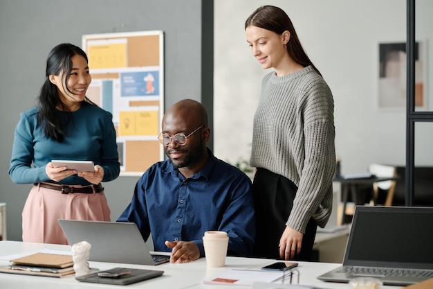 Multiethnic coworkers working in office