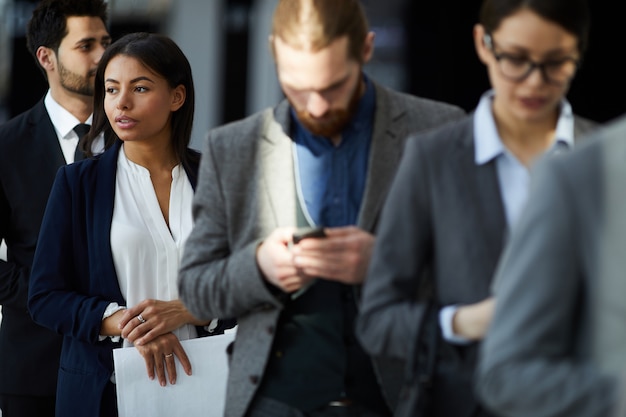 Multiethnic group of business people in line