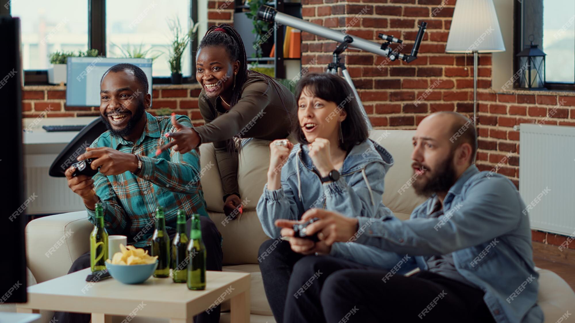 Multiethnic group of people playing online video games on tv