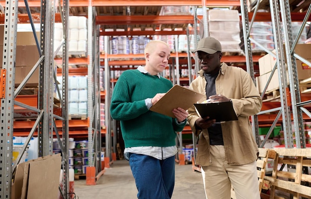 Multiethnic industrial workers working in warehouse