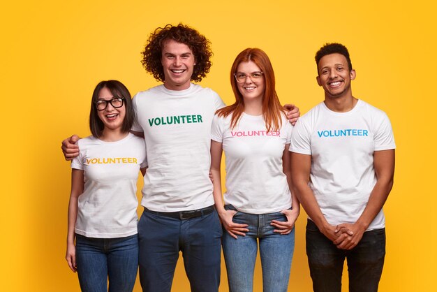 Multiethnic volunteers smiling for camera