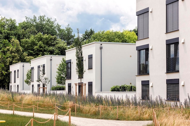 multifamily residential apartment building with lanscape design modern white high rise buildings