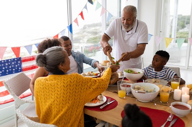 Multigeneration family having meal on a dining table