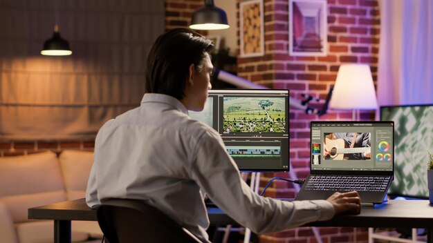 multimedia artist editing video montage with sound and visual effects, creative gradient with color for film production. developing footage with editor software for freelance content.