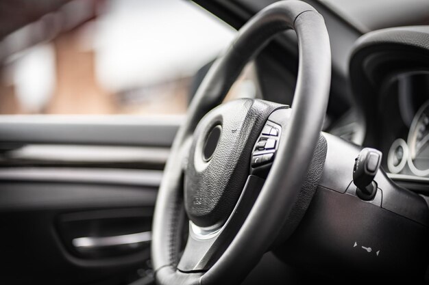 Multimedia control panel on the steering wheel of a modern\
car