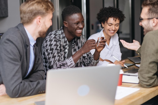 Multinational business team discussing ideas for a joint startup