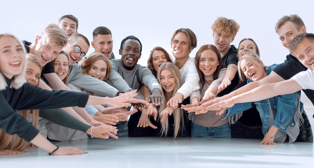 Multinational group of young people joining their palms photo with copy space