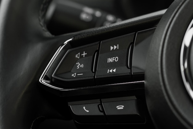 Multiple buttons on the steering wheel to accept or reject calls from the phone close up view Answer and reject phone buttons