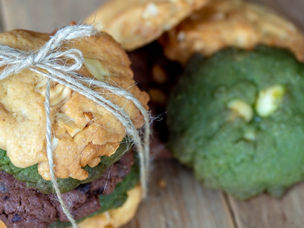 Photo multiple color cookies inclusive peanut butter, green tea cookies, and chocolate chip cook