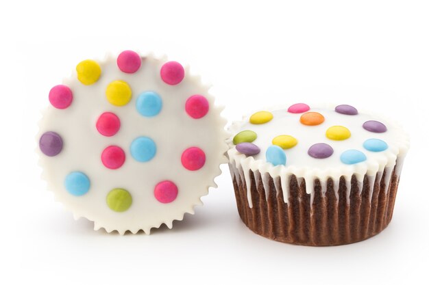 Multiple colorful decorated muffins isolated