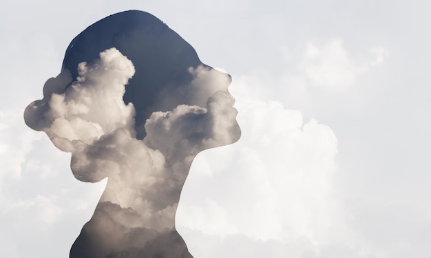 Photo multiple exposure clouds woman mental health and weather dependent concept.