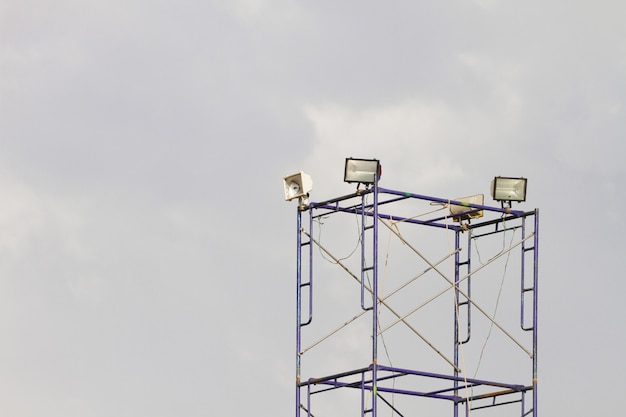 Multiple spotlights on a theatre stage lighting rig