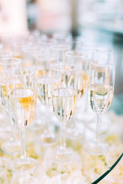 Multiple wineglasses on catering table