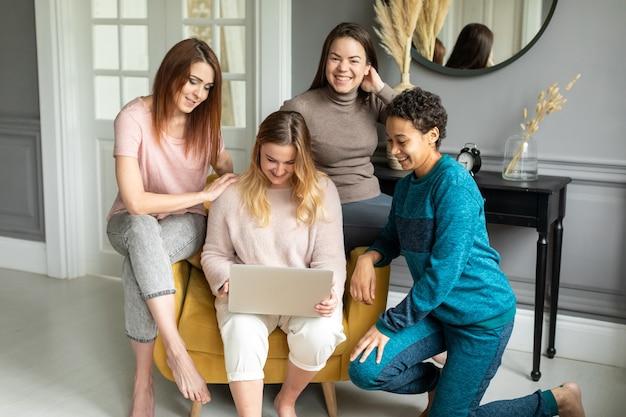 Multiracial friends spending time together indoors