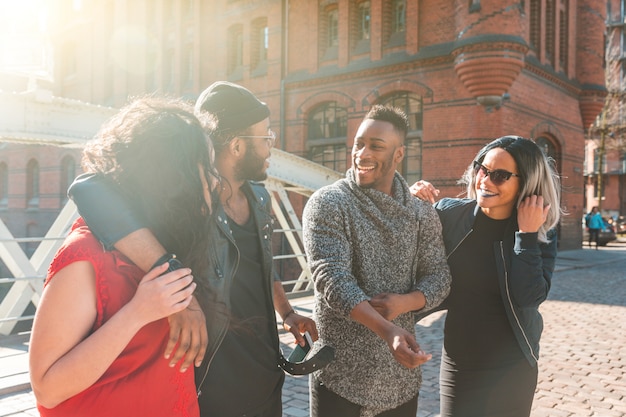 Multiracial group of friends having fun and laughing together