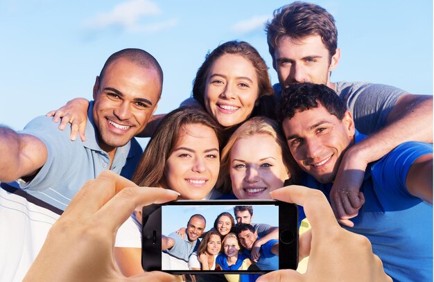 Multiracial Group of Friends Taking Selfie at Beach