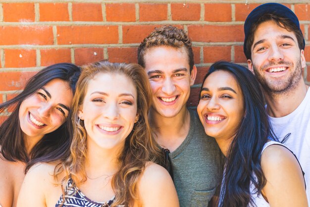 Multiracial group of friends taking a selfie together 