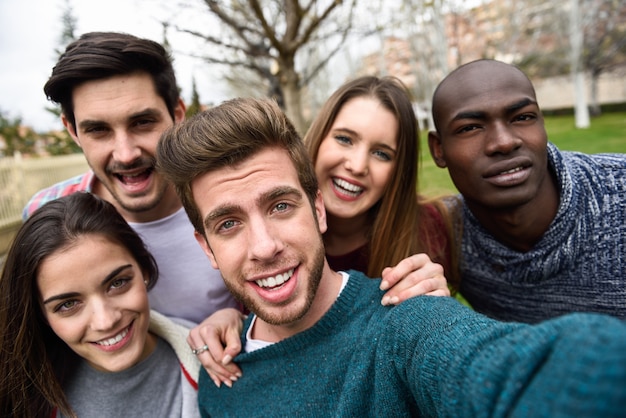 Multiracial group of friends taking selfie