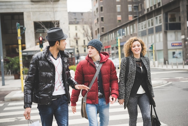 Multiracial group of two men and woman friends outdoor