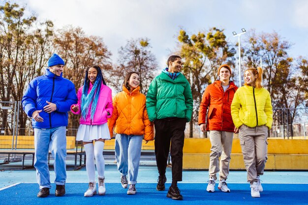 Multiracial group of young friends meeting outdoors in winter