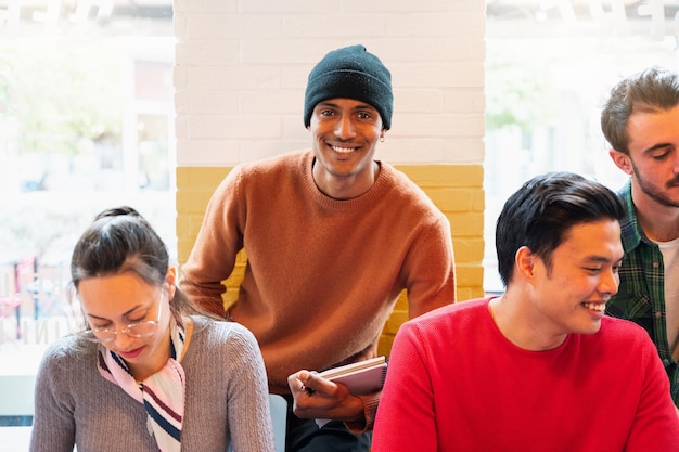 Multiracial group of young people studying together