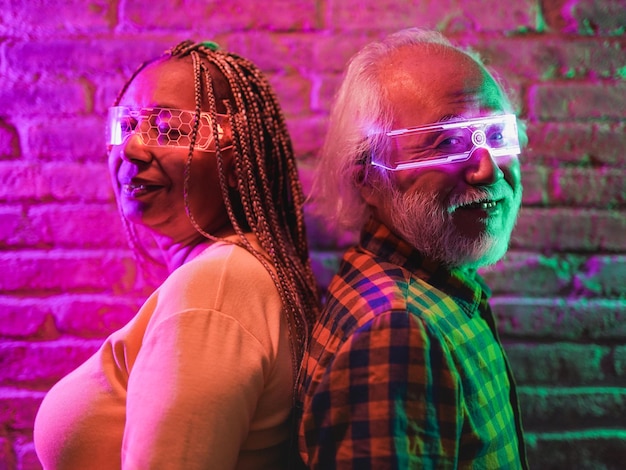 multiracial mature friends having fun using using 3d glasses