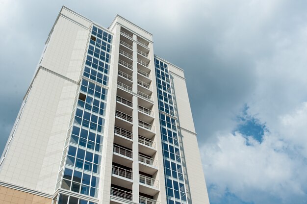 Multistorey residential house on blue sky background