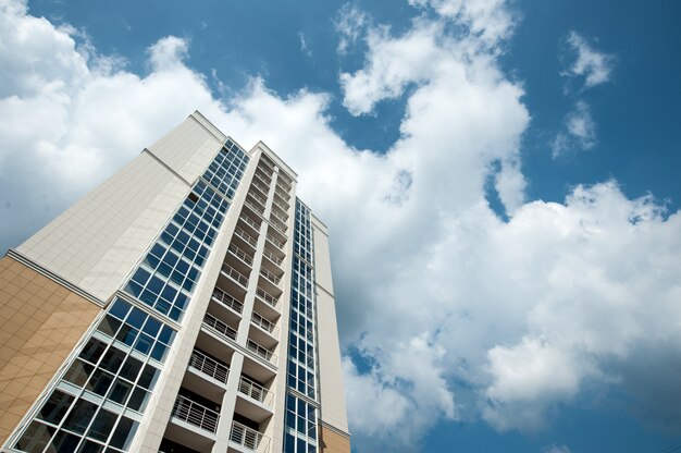 Multistorey residential house on blue sky background