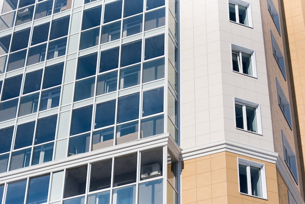 Multistorey residential house on blue sky background