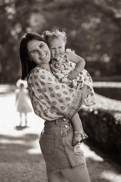 Mum and baby daughter smile and play