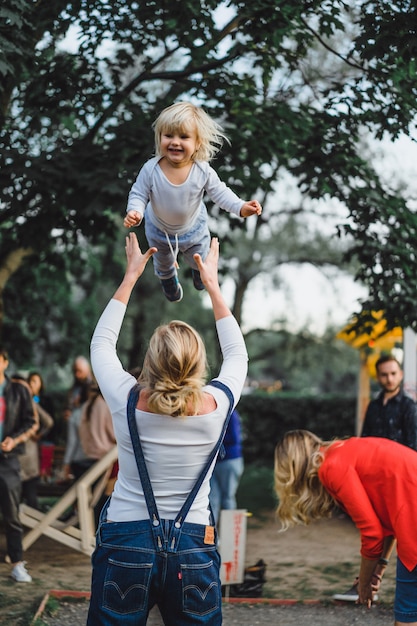 Mum tosses the child in air