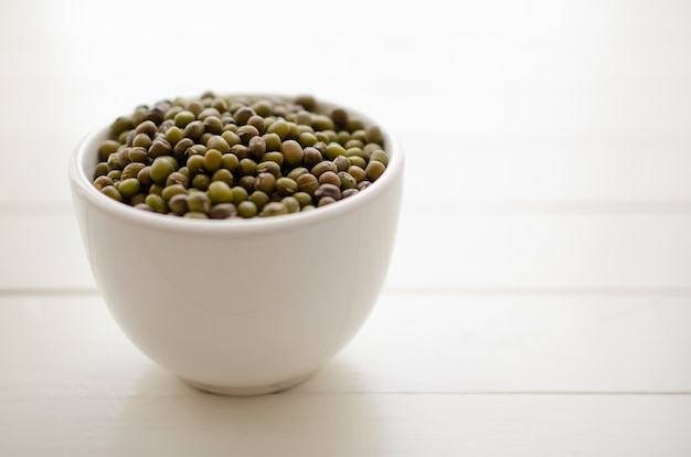 Mung beans in a white bowl