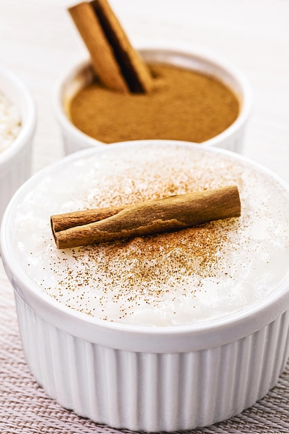 Mungunza or Canjica a traditional sweet for Brazilian June festivals with crushed corn and cinnamon in the background typical food of the June festivities