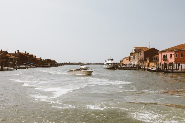 Murano, Venice, Italy - July 2, 2018: Panoramic view of Murano island is a series of islands linked by bridges in the Venetian Lagoon, northern Italy. Summer sunny day and blue sky