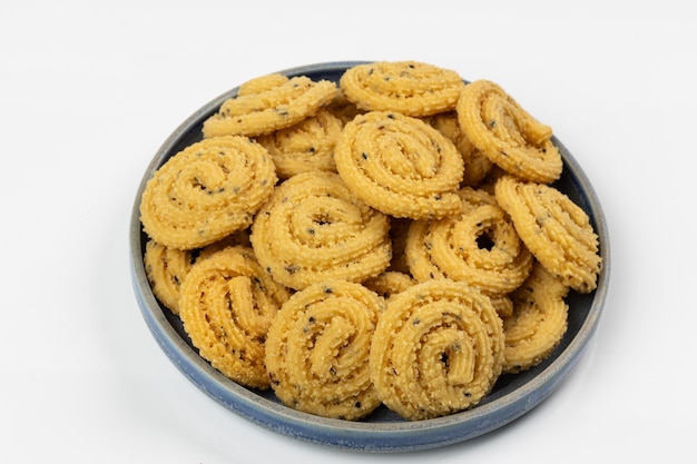 murukku kerala special snack made using rice flour isolated image arranged in white background