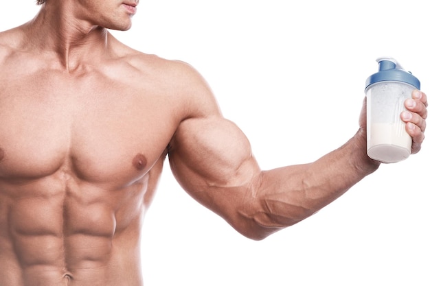 Muscular bodybuilder with a shaker full of whey protein