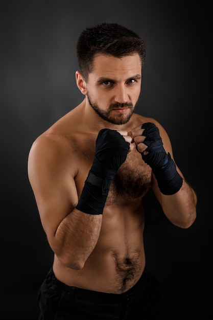 Muscular boxing man ready to fight