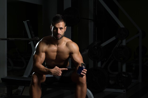 Muscular Handsome Bodybuilder With Pills And Dope For Copy Space