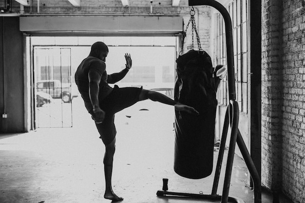 Muscular male boxer at the gym